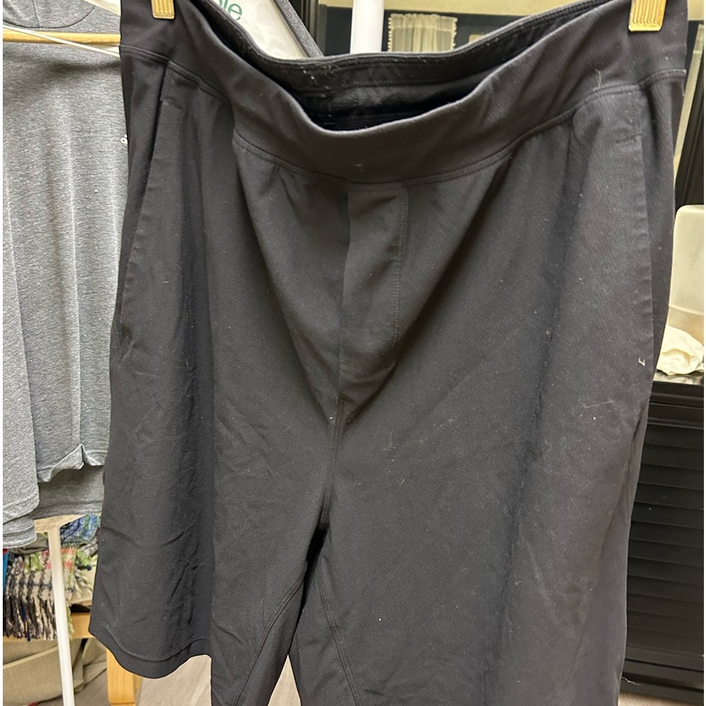 Lululemon athletic shorts. 8”? Not sure. Hit just above the knee. Black